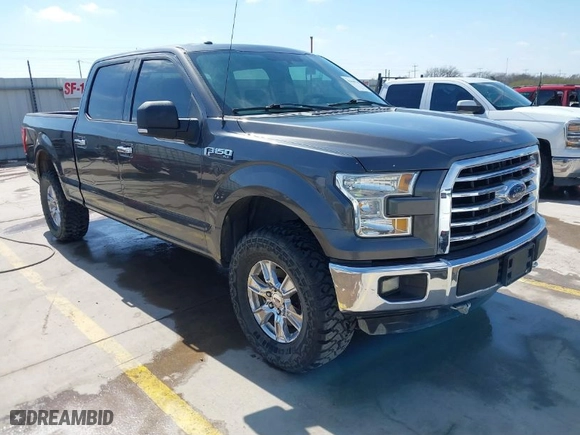 2015 Ford F-150 XLT w/HD Payload Pkg with VIN 1FTFW1EF7FKD04869, listed as a IAAI auction lot 41664736 with 165,784 mi miles. Bid and sale history available at carsss.com. Image 1.