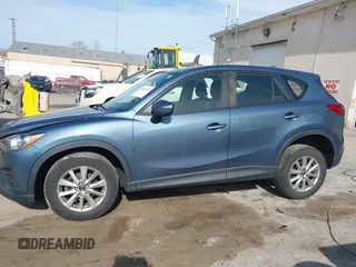 2016 Mazda CX-5 Sport with VIN JM3KE4BY0G0746034, listed as a IAAI auction lot 41842894 with 92,801 mi miles. Bid and sale history available at carsss.com. Image 14.