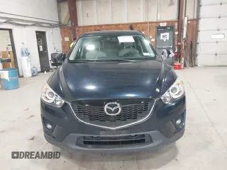 2015 Mazda CX-5 Grand Touring z VIN JM3KE4DYXF0490920, wystawiony jako IAAI lot #42367194 z przebiegiem 80 436 mil mil oraz . Historia ofert i sprzedaży dostępna na DreamBid. Obrazek 12.
