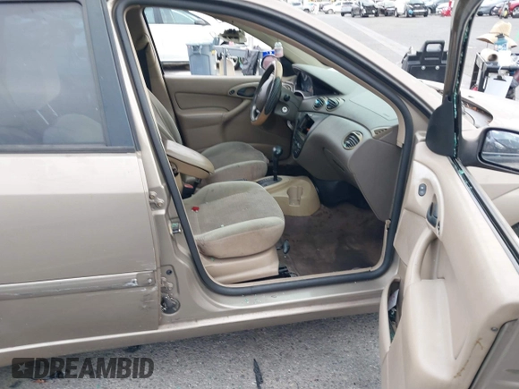 2003 Ford Focus SE z VIN 1FAFP34Z73W236474, wystawiony jako IAAI lot #39378102 z przebiegiem 183 280 mil mil oraz . Historia ofert i sprzedaży dostępna na DreamBid. Obrazek 5.