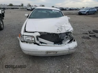 2000 Ford Crown Victoria LX z VIN 2FAFP74W4YX120352, wystawiony jako Copart lot #79833264 z przebiegiem Nie podano mil oraz Szkoda całkowita • Salvage title. Historia ofert i sprzedaży dostępna na DreamBid. Obrazek 5.