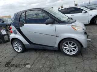 2009 Smart fortwo Pure with VIN WMEEJ31X89K251402, listed as a Copart auction lot 56791545 with 52,636 mi miles and Clean title. Bid and sale history available at DreamBid. Image 4.