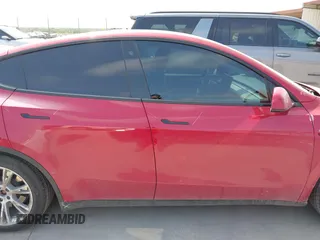 2023 Tesla Model Y Long Range z VIN 7SAYGAEE7PF691499, wystawiony jako IAAI lot #42038850 z przebiegiem 26 439 mil mil oraz . Historia ofert i sprzedaży dostępna na DreamBid. Obrazek 14.