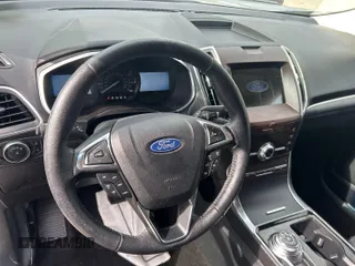 2020 Ford Edge Titanium z VIN 2FMPK3K95LBA30633, wystawiony jako IAAI lot #42473515 z przebiegiem 104 190 mil mil oraz . Historia ofert i sprzedaży dostępna na DreamBid. Obrazek 5.