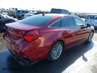 2019 Toyota Avalon Hybrid Limited with VIN 4T1B21FB8KU010221, listed as a IAAI auction lot 41470592 with 100,869 mi miles. Bid and sale history available at carsss.com. Image 4.