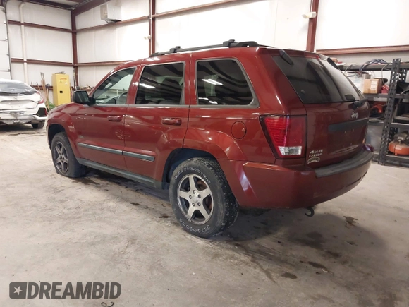2007 Jeep Grand Cherokee Laredo with VIN 1J8GR48K97C631672, listed as a IAAI auction lot 41520054 with 231,576 mi miles. Bid and sale history available at carsss.com. Image 3.