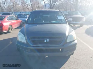 2005 Honda Pilot EX-L with NAVI with VIN 2HKYF18775H553666, listed as a IAAI auction lot 41858179 with 241,011 mi miles. Bid and sale history available at carsss.com. Image 6.