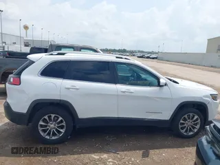 2019 Jeep Cherokee Latitude Plus with VIN 1C4PJMLB5KD198571, listed as a IAAI auction lot 42126995 with 124,230 mi miles. Bid and sale history available at carsss.com. Image 13.