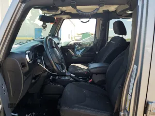 2014 Jeep Wrangler Unlimited Rubicon with VIN 1C4HJWFG1EL241014, listed as a Copart auction lot 63948655 with 165,650 mi miles and Salvage title. Bid and sale history available at DreamBid. Image 7.