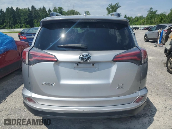 2018 Toyota RAV4 LE with VIN JTMBFREV3JJ236153, listed as a Copart auction lot 62642325 with 70,261 mi miles and Salvage title. Bid and sale history available at DreamBid. Image 6.