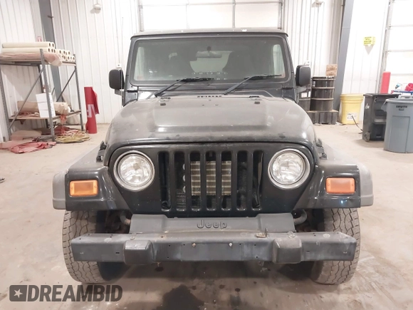 2006 Jeep Wrangler Sport Right Hand Drive with VIN 1J4F449S56P741328, listed as a IAAI auction lot 41476847 with 67,203 mi miles. Bid and sale history available at carsss.com. Image 6.