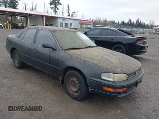 1994 Toyota Camry LE z VIN JT2GK12E1R0036423, wystawiony jako IAAI lot #41922375 z przebiegiem 211 529 mil mil oraz . Historia ofert i sprzedaży dostępna na DreamBid. Obrazek 1.