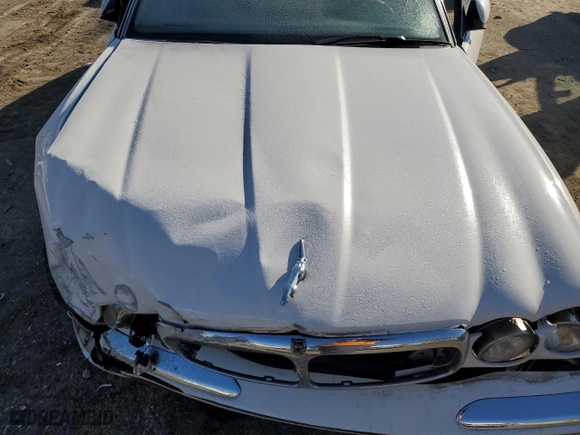 2001 Jaguar XJ with VIN SAJDA14CX1LF29825, listed as a Copart auction lot 42064715 with 127,389 mi miles and Salvage Title. Bid and sale history available at carsss.com. Image 13.