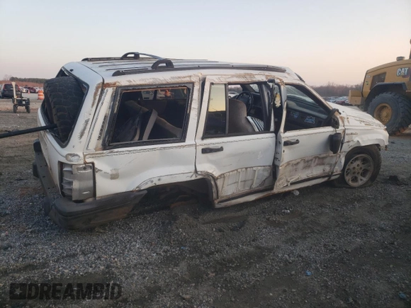 1993 Jeep Grand Cherokee Laredo with VIN 1J4GZ58Y9PC677532, listed as a Copart auction lot 44391245 with 178,772 mi miles and Salvage Title. Bid and sale history available at carsss.com. Image 3.
