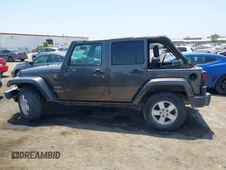 2016 Jeep Wrangler Unlimited Sahara with VIN 1C4HJWEG2GL273507, listed as a IAAI auction lot 39855004 with 87,011 mi miles and . Bid and sale history available at DreamBid. Image 14.
