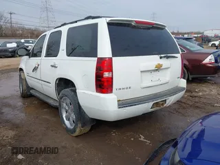 2009 Chevrolet Tahoe LTZ with VIN 1GNFK33079R293963, listed as a IAAI auction lot 41662695 with 185,408 mi miles and . Bid and sale history available at DreamBid. Image 3.