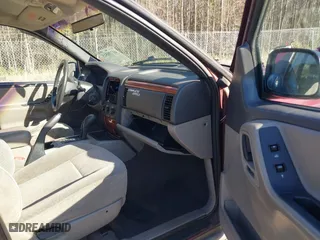 1999 Jeep Grand Cherokee Laredo with VIN 1J4GW58S5XC781472, listed as a IAAI auction lot 41738515 with 216,000 mi miles. Bid and sale history available at carsss.com. Image 5.
