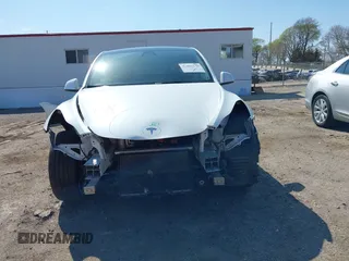 2021 Tesla Model Y Long Range with VIN 5YJYGDEE4MF122362, listed as a IAAI auction lot 42096138 with 47,006 mi miles and . Bid and sale history available at DreamBid. Image 6.