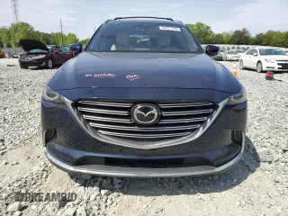 2016 Mazda CX-9 Grand Touring with VIN JM3TCBDY0G0116686, listed as a Copart auction lot 54077335 with 142,670 mi miles and Salvage title. Bid and sale history available at DreamBid. Image 5.