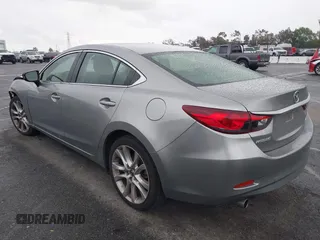 2014 Mazda 6 i Touring with VIN JM1GJ1V60E1141831, listed as a IAAI auction lot 42131200 with 86,597 mi miles and . Bid and sale history available at DreamBid. Image 3.