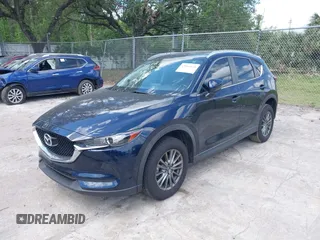 2017 Mazda CX-5 Touring with VIN JM3KFACL0H0227615, listed as a IAAI auction lot 42063618 with 72,291 mi miles. Bid and sale history available at carsss.com. Image 2.