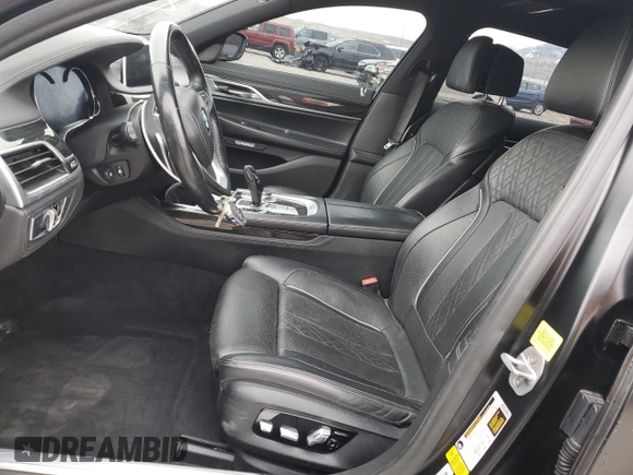 2018 BMW 7 Series 750i with VIN WBA7F0C55JGM23537, listed as a Copart auction lot 76824074 with 64,682 mi miles and Salvage Title. Bid and sale history available at carsss.com. Image 7.