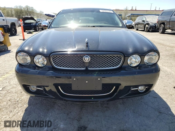 2009 Jaguar XJ 8 with VIN SAJWA71B79SH30431, listed as a Copart auction lot 52403185 with 67,143 mi miles and Salvage Title. Bid and sale history available at DreamBid. Image 5.