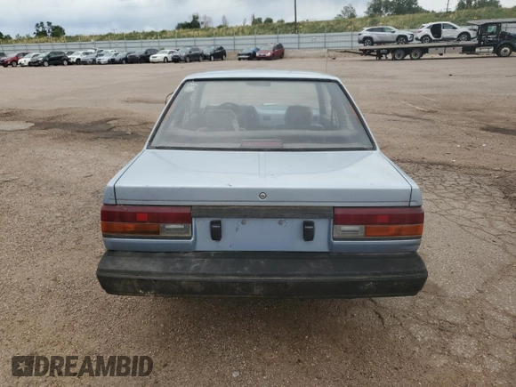 1987 Nissan Sentra z VIN JN1PB2210HU557007, wystawiony jako Copart lot #68174784 z przebiegiem 150 316 mil mil oraz Czysty tytuł • Clean title. Historia ofert i sprzedaży dostępna na DreamBid. Obrazek 6.
