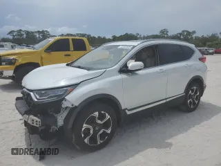 2018 Honda CR-V Touring z VIN 2HKRW2H97JH600992, wystawiony jako Copart lot #53463695 z przebiegiem 94 351 mil mil oraz Szkoda całkowita • Salvage title. Historia ofert i sprzedaży dostępna na DreamBid. Obrazek 1.