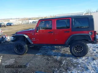 2007 Jeep Wrangler Unlimited X with VIN 1J4GA39137L104767, listed as a IAAI auction lot 41348113 with 175,353 mi miles and . Bid and sale history available at DreamBid. Image 14.