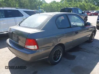 2001 Hyundai Accent GLS z VIN KMHCG35C01U136132, wystawiony jako IAAI lot #42293830 z przebiegiem 111 906 mil mil oraz . Historia ofert i sprzedaży dostępna na DreamBid. Obrazek 4.