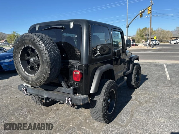2002 Jeep Wrangler Sport with VIN 1J4FA49S32P765579, listed as a Copart auction lot 55244845 with 127,791 mi miles and Clean Title. Bid and sale history available at carsss.com. Image 4.