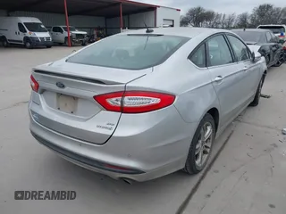 2016 Ford Fusion SE Hybrid with VIN 3FA6P0LU2GR340755, listed as a IAAI auction lot 41673932 with 191,650 mi miles. Bid and sale history available at carsss.com. Image 4.