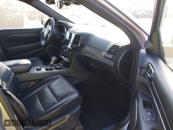 2020 Jeep Grand Cherokee Overland with VIN 1C4RJFCG8LC158475, listed as a IAAI auction lot 40665109 with 77,233 mi miles. Bid and sale history available at carsss.com. Image 5.