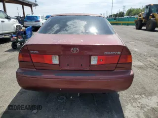 2000 Toyota Camry CE z VIN JT2BG22K4Y0449443, wystawiony jako Copart lot #58268475 z przebiegiem 292 853 mil mil oraz Szkoda całkowita • Salvage title. Historia ofert i sprzedaży dostępna na DreamBid. Obrazek 6.