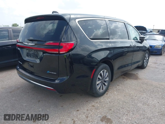 2023 Chrysler Pacifica Hybrid Touring L with VIN 2C4RC1L75PR611901, listed as a IAAI auction lot 42626500 with 44,156 mi miles and . Bid and sale history available at DreamBid. Image 4.