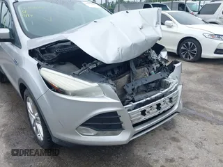 2013 Ford Escape SEL z VIN 1FMCU9H97DUA34665, wystawiony jako IAAI lot #42258567 z przebiegiem 174 227 mil mil oraz . Historia ofert i sprzedaży dostępna na DreamBid. Obrazek 6.