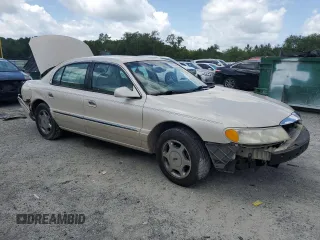 2001 Lincoln Continental z VIN 1LNHM97V91Y622267, wystawiony jako Copart lot #59915445 z przebiegiem 77 070 mil mil oraz Szkoda całkowita • Salvage title. Historia ofert i sprzedaży dostępna na DreamBid. Obrazek 4.