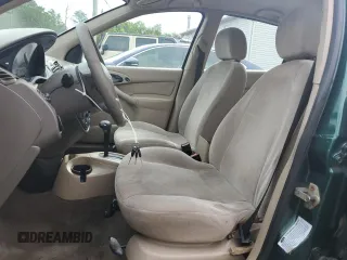 2000 Ford Focus SE with VIN 1FAFP3433YW354797, listed as a Copart auction lot 61430265 with 165,202 mi miles and Salvage title. Bid and sale history available at DreamBid. Image 7.
