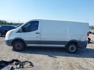 2015 Ford Transit Cargo with VIN 1FTNE1ZM0FKA90248, listed as a IAAI auction lot 41995824 with 157,085 mi miles. Bid and sale history available at carsss.com. Image 14.