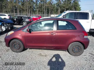 2009 Toyota Yaris with VIN JTDJT903295239611, listed as a IAAI auction lot 42216768 with 122,512 mi miles and . Bid and sale history available at DreamBid. Image 14.