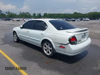 2000 Nissan Maxima GXE z VIN JN1CA31D6YT542083, wystawiony jako IAAI lot #42306685 z przebiegiem 296 613 mil mil oraz . Historia ofert i sprzedaży dostępna na DreamBid. Obrazek 3.