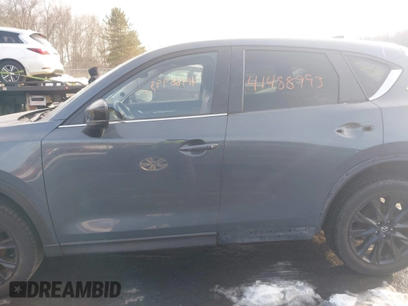2021 Mazda CX-5 Touring z VIN JM3KFBCMXM0463469, wystawiony jako IAAI lot #41488993 z przebiegiem 28 582 mil mil oraz . Historia ofert i sprzedaży dostępna na DreamBid. Obrazek 14.