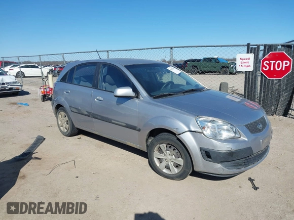 2009 Kia Rio LX with VIN KNADE243596530314, listed as a IAAI auction lot 41681050 with 114,831 mi miles. Bid and sale history available at carsss.com. Image 1.