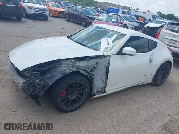 2012 Nissan 370Z z VIN JN1AZ4EH5CM564517, wystawiony jako IAAI lot #42385869 z przebiegiem 55 359 mil mil oraz . Historia ofert i sprzedaży dostępna na DreamBid. Obrazek 18.