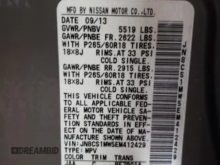 2014 Infiniti QX70 z VIN JN8CS1MW5EM412429, wystawiony jako Copart lot #82933934 z przebiegiem Nie podano mil oraz Szkoda całkowita • Salvage title. Historia ofert i sprzedaży dostępna na DreamBid. Obrazek 13.