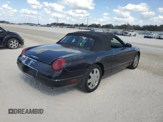 2002 Ford Thunderbird Hardtop Premium with VIN 1FAHP60A12Y120989, listed as a Copart auction lot 77573084 with Not Provided miles and Salvage Title. Bid and sale history available at DreamBid. Image 3.