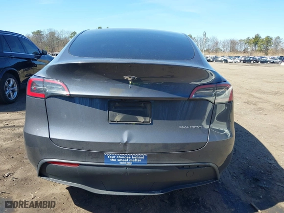 2023 Tesla Model Y Long Range with VIN 7SAYGDEEXPA175104, listed as a IAAI auction lot 41821928 with 52,791 mi miles. Bid and sale history available at carsss.com. Image 16.