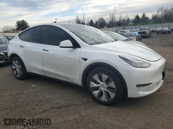 2023 Tesla Model Y Long Range with VIN 7SAYGDEE3PA130988, listed as a Copart auction lot 42172185 with 112,136 mi miles and Salvage Title. Bid and sale history available at DreamBid. Image 4.