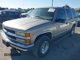 1999 Chevrolet Tahoe Z71 with VIN 1GNEK13R7XJ521373, listed as a IAAI auction lot 42131893 with 250,712 mi miles and . Bid and sale history available at DreamBid. Image 2.